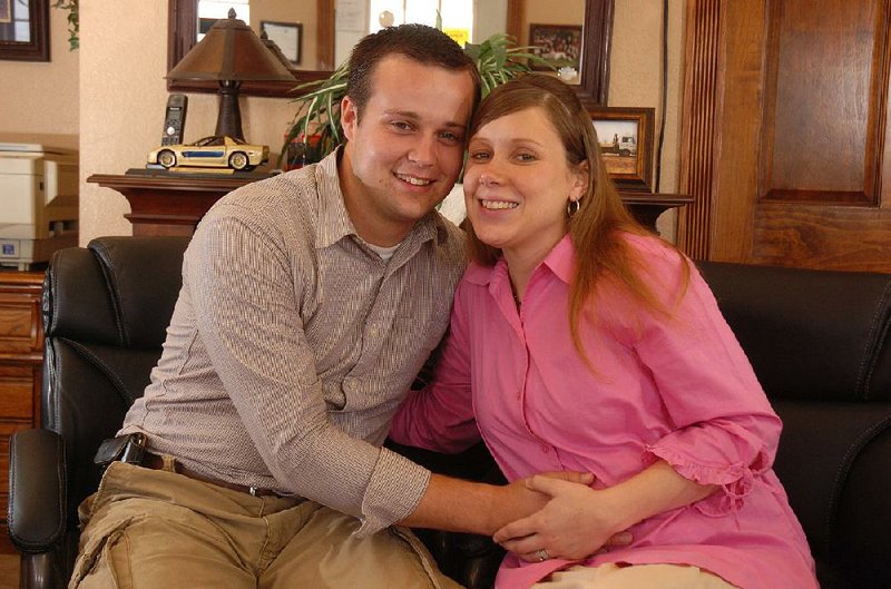 Josh Duggar and his wife, Anna, are shown when they were expecting their first child in this 2009 file photo. The former reality show couple are now the parents of four.
