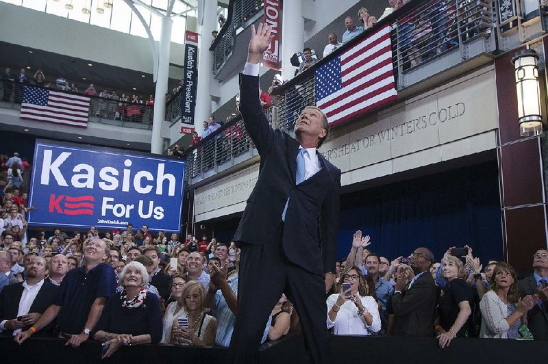 Ohio Gov. John Kasich announces he is running for the 2016 Republican party’s nomination for president Tuesday during a campaign rally at Ohio State University in Columbus, Ohio. 