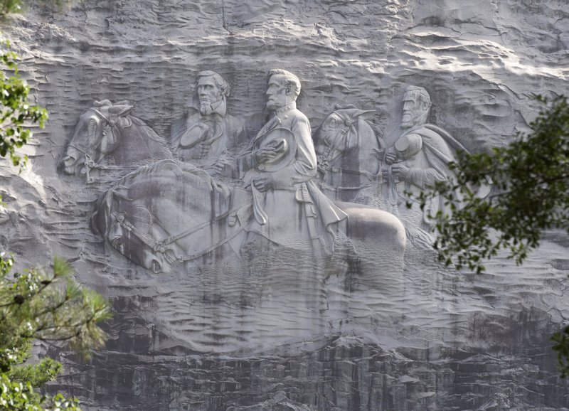 The Associated Press MONUMENTAL CONTROVERSY: A photo shows a carving depicting confederates Stonewall Jackson, Robert E. Lee and Jefferson Davis, in Stone Mountain, Ga.