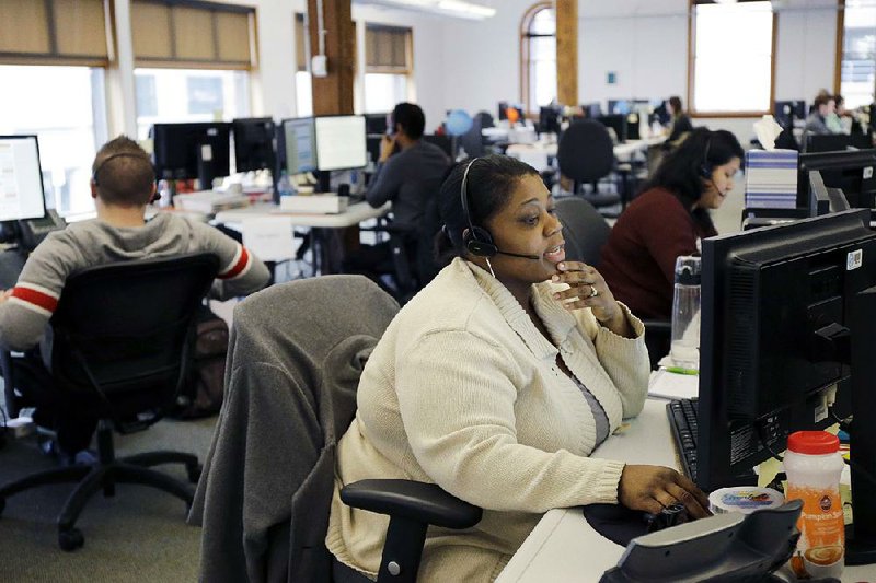 Loretha Cager is shown in this March 2014 file photo. Cager was talking with an applicant at MNSure’s call center in St. Paul, Minn., a state-run health insurance market that offers taxpayer-subsidized coverage under the Patient Protection and Affordable Care Act.