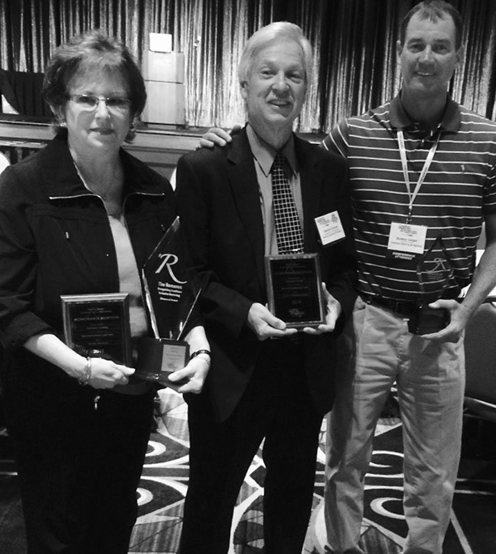 Submitted photo DOUBLE WINNER: Oaklawn Racing and Gaming received top honors during the recent Gaming Marketing & Technology Conference. From left are Kim Baron, Dennis Conrad, of Raving Consulting, and Bobby Geiger.