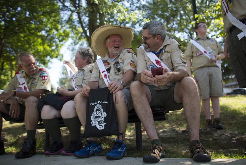 Wayne Harrell (from left) of El Dorado, Sylvia Wray of Camden, Scott O’Hara of Camden, Rollin Wycoff of Camden, and Jacob Phillips, 13, of El Dorado, share stories at the Boy Scouts of America’s Arrow Tour on Sunday in Little Rock’s Riverfront Park. The tour’s traveling exhibit commemorates the 100th anniversary of the Order of the Arrow.