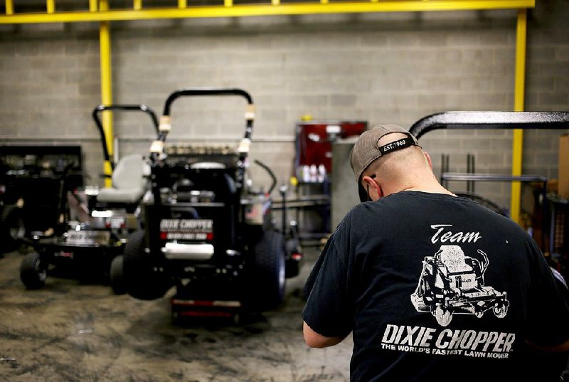 A worker gives a lawnmower a final inspection at the Dixie Chopper manufacturing plant in Coatesville, Ind., on June 12. Orders for durable goods rose 3.4 percent in June from May, the Commerce Department said Monday.