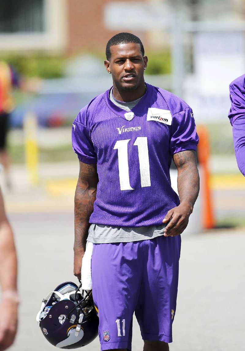 Minnesota Vikings wide receiver Mike Wallace walks to the practice fields at an NFL football training camp Sunday on the campus of Minnesota State University in Mankato, Minn.