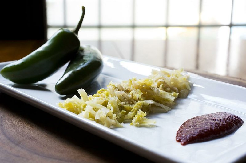 Foods such as pickled jalapeno peppers, sauerkraut and ketchup are easy to ferment at home using minimal equipment and everyday ingredients.