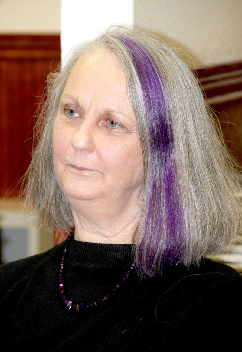 LYNN KUTTER ENTERPRISE-LEADER Local author Pamela Foster with her signature purple streak in her hair.