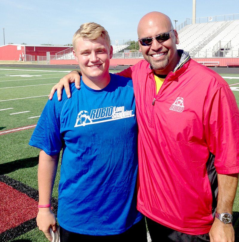 Photos submitted Siloam Springs senior Parker Hall recently participated in Chris Rubio Long Snapping camp held in Dallas, where he took fourth place out of more than 70 snappers in the snapping accuracy competition. Hall started at center for the Panthers as a junior last season but he broke his right hand in practice after the win against Alma. He missed two games and returned to the lineup after teaching himself to snap with his left hand. Hall is pictured here with Rubio, who was a long snapper for UCLA. Rubio has helped kids land scholarships to colleges all across the country.