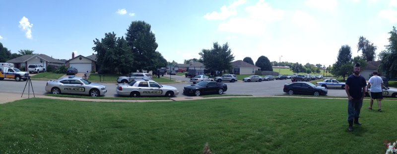 Springdale police and neighbors in a neighborhood where a man was reported barricaded in a house with a gun.