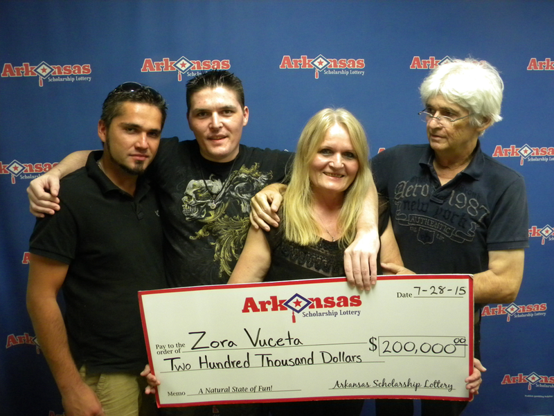 Zora Vuceta, pictured with her husband Zeljkr and sons Sasha and Igor, won $200,000 in the Arkansas Scholarship Lottery on Wednesday, lottery officials announced. 