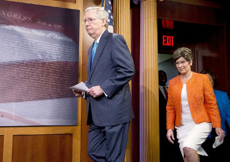Senate Majority Leader Mitch McConnell and Sen. Joni Ernst, R-Iowa, arrive for a news conference Wednesday to talk about Ernst’s bill to end federal funding for Planned Parenthood.