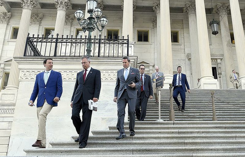 Members of the House leave the Capitol to begin their August recess Wednesday after approving stopgap funding for highways and veterans’ health care. 