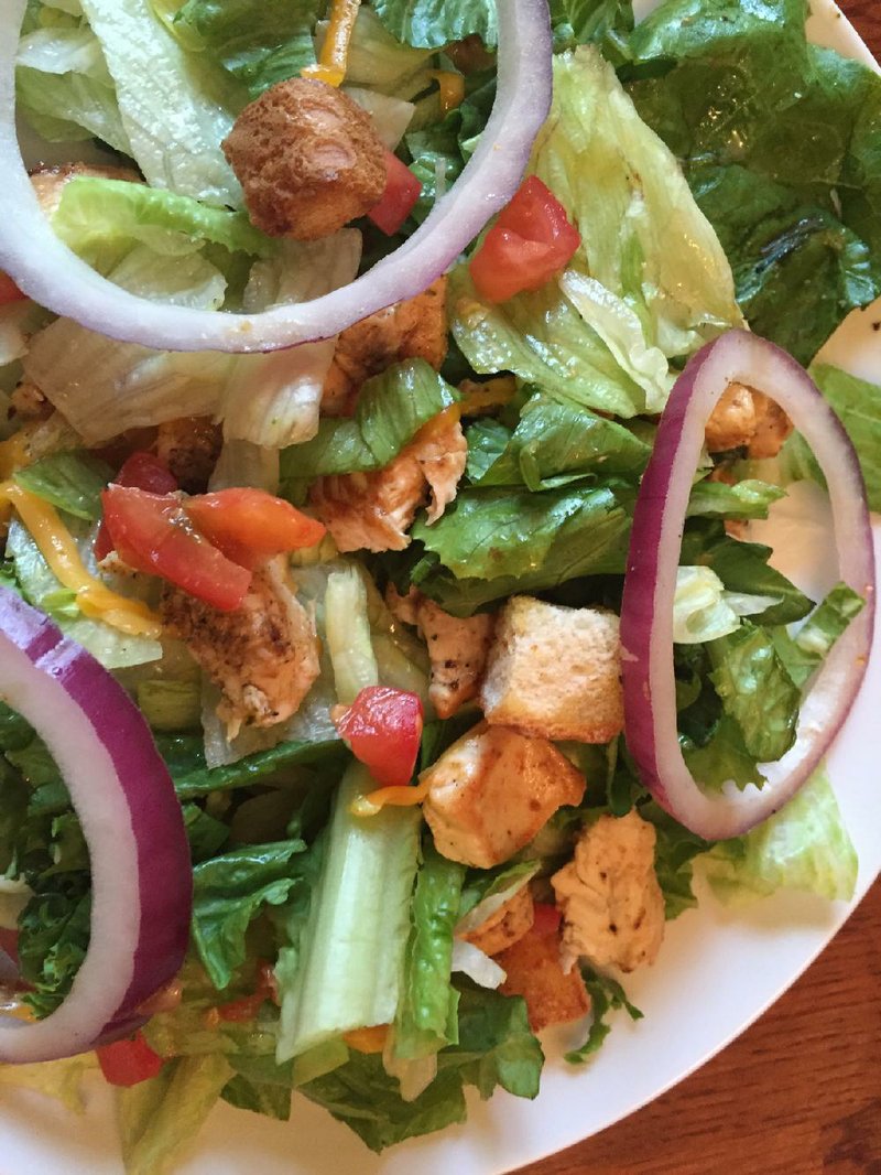 The grilled chicken salad is one of three salad options offered during lunch at Sawbucks. 