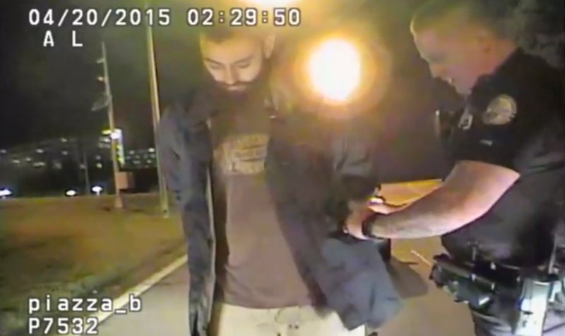 In this April 20, 2015 frame from dashcam video provided by the Chattanooga Police Department, Mohamad Youssef Abdulazeez is detained following roadside sobriety checks in Chattanooga, Tenn. 