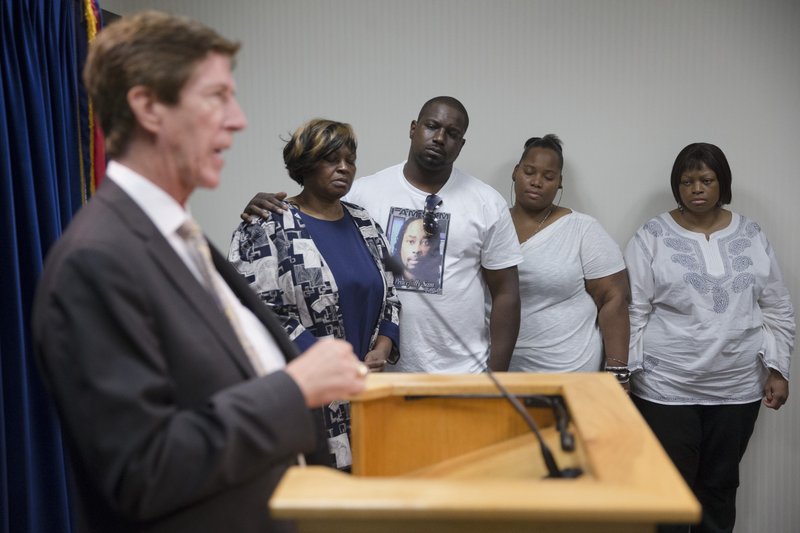 Attorney Mark O’Mara speaks Wednesday at a news conference after University of Cincinnati police officer Ray Tensing was charged with murder and manslaughter in the shooting death of motorist Samuel DuBose. Looking on are DuBose family members (from left) Audrey DuBose, Aubrey DuBose, Cleshawn DuBos, and Terina Allen.