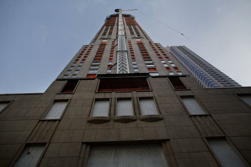 A construction crane was attached to 30 Park Place in New York in January. At 82 stories, the tower will be the tallest residential building in downtown Manhattan. The June median rental price in the New York metro area was $2,340 a month. 