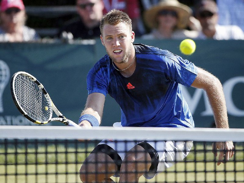 Jack Sock plays against Ivo Karlovic of Croatia during a Tennis Hall of Fame Championship semifinal match in Newport, R.I., on July 18.