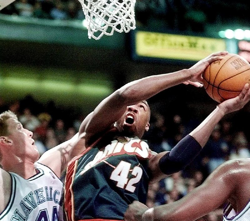 Vin Baker, shown here in a 1998 file photo, spent five seasons of his 13-year NBA career with the Seattle SuperSonics in 1997-2002. After struggles following his retirement in 2006, he is now managing a franchise for Seattle-based Starbucks.
