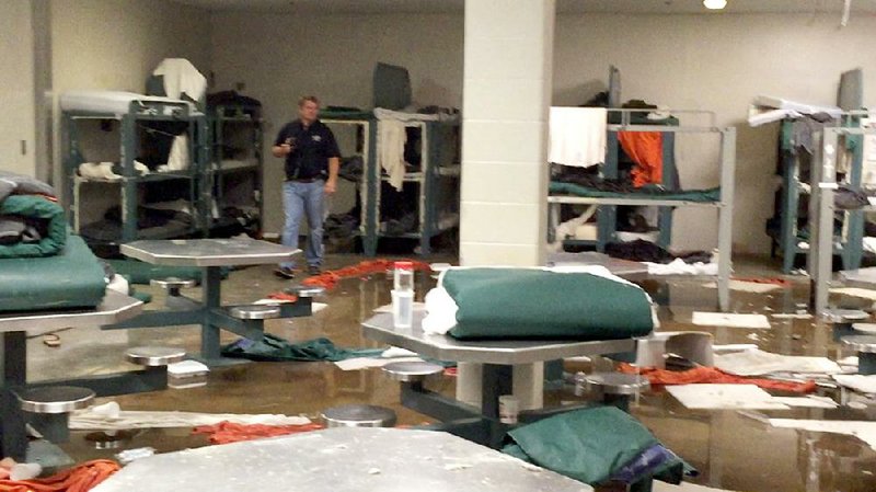 Jefferson County jail inmates vandalized their living quarters Wednesday night, causing about $20,000 in damage. 
