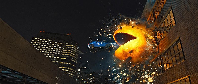 Pac Man tries to eat one of the “ghost” Mini Coopers in Columbia Pictures’ "Pixels." The film, which stars Adam Sandler, came in second at last weekend’s box office and made about $24 million.