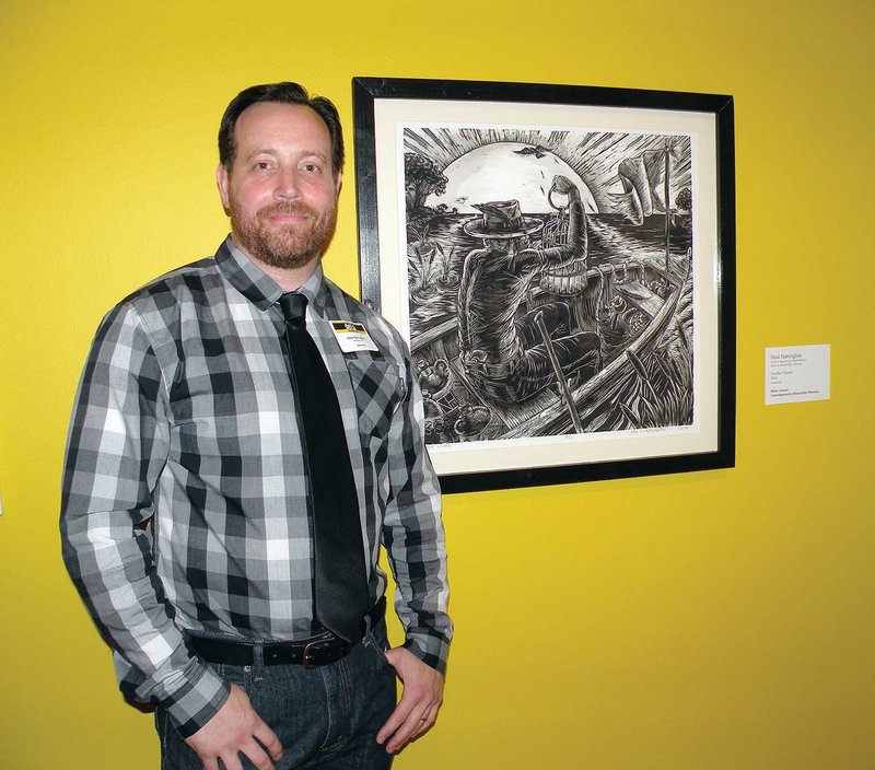 Neal K. Harrington of Russellville won a Delta Award at the 57th annual Delta Exhibition at the Arkansas Arts Center in Little Rock. He is shown here during the opening reception July 9 with his woodcut Feather 
Signal. He also received a Contemporaries honorable-mention award for his work. The exhibition will remain on display through Sept. 20.