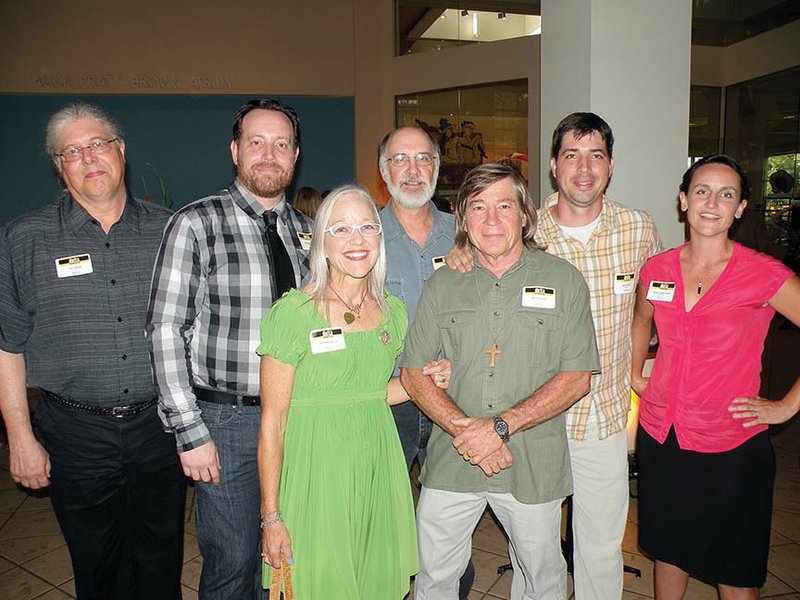 Seven artists with ties to the River Valley & Ozark Edition coverage area have works in the 57th annual Delta Exhibition at the Arkansas Arts Center in Little Rock. Shown here at the opening reception are, front row, from left, Katherine A. Strause, who lives in Little Rock but is a native of Conway; and Dennis R. McCann of Maumelle. In the back row are Terry Wright, who lives in Little Rock but works at the University of Central Arkansas; Neal K. Harrington and David Mudrinich, both of Russellville; Jason B. McCann of Maumelle; and Melissa Cowper-Smith of Morrilton.