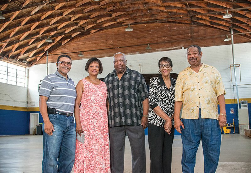 Homecoming will begin Thursday in Malvern. Planning committee members, shown here in the old gymnasium of A.A. Wilson High School, are, from left, the Rev. Henry “Hank” Mitchell, Laura Hunter, Jim Hunter, Dorothy Beard and Edward Green. The old high school building has been restored and is now the Victory Praise and Worship Church and Community Center. Mitchell serves as pastor of the church and was the principal force in restoring the building.