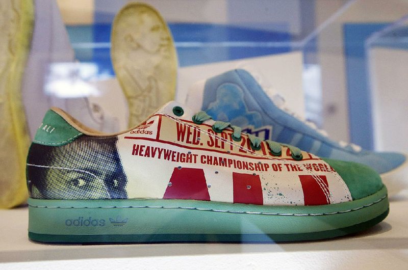 An image of Muhammad Ali appears on a 2007 sneaker, a collaboration by artist/designer Cey Adams and Adidas, displayed as part of “The Rise of Sneaker Culture” exhibit at the Brooklyn Museum of Art in New York.