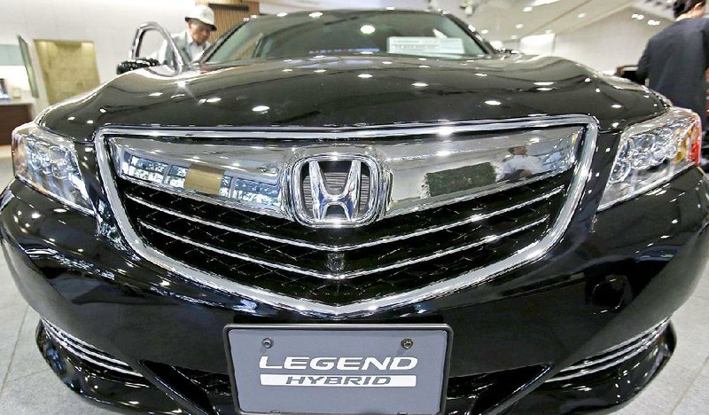 A Honda Legend hybrid car is displayed at a showroom in Tokyo. Honda and other Japanese carmakers have bucked a slowdown in the Chinese market this year.