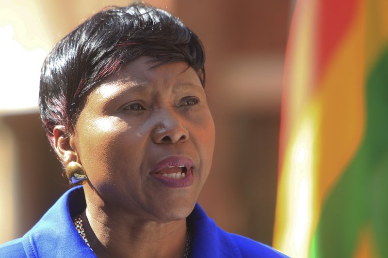 Oppah Muchinguri, the Zimbabwean  Minister of  Environment, Water and Climate addresses a  press conference in Harare, Zimbabwe, Friday, July, 31, 2015. Zimbabwe intends to seek the extradition of an American dentist who killed a lion that was lured out of a national park and shot with a bow and a gun, and the process has already begun, a Cabinet minister said Friday. 