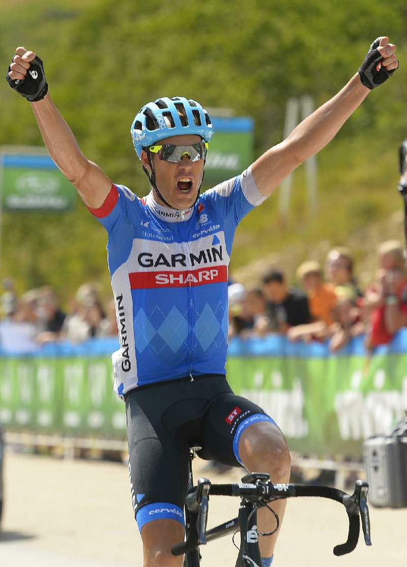 Tour of Utah stage four winner Tom Danielson celebrates after finishing the stage at the top of Powder Mountain in Eden, Utah, in this August 2014 file photo.