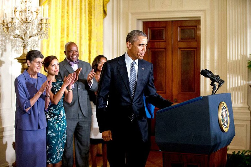 President Barack Obama arrives Monday to speak about his Clean Power Plan in the East Room at the White House in Washington. The president is mandating even steeper greenhouse gas cuts from U.S. power plants than previously expected, while granting states more time and broader options to comply.