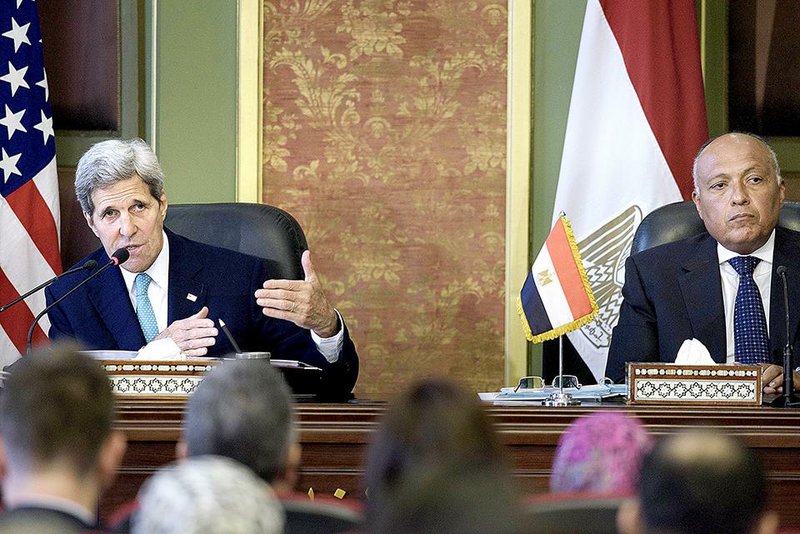 U.S. Secretary of State John Kerry speaks during a news conference with Egyptian Foreign Minister Sameh Shoukry (right) after their meeting at the Foreign Ministry in Cairo on Sunday.