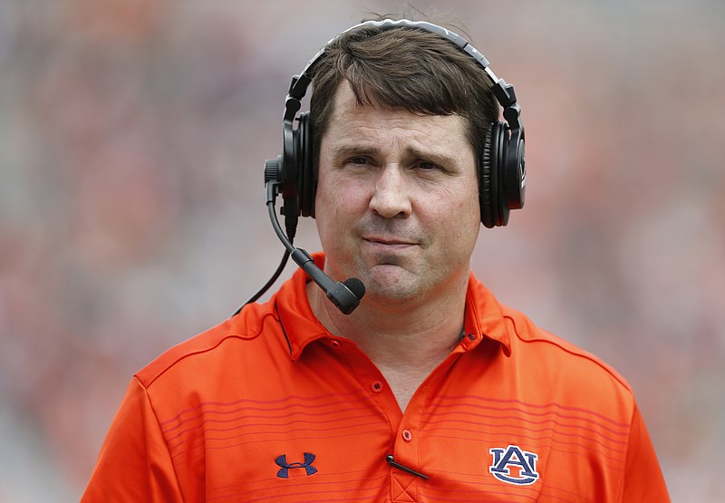 The Associated Press COORDINATING CAROUSEL: Auburn defensive coordinator Will Muschamp walks around the field during the first quarter of the Tigers' spring game April 18 in Auburn, Ala. The Southeastern Conference will have 14 new coordinators this season. In typical SEC style, some have been spare-no-expense hires. Defensive coordinators Muschamp and John Chavis at Texas A&M are each making at least $5 million over the next three years at their new jobs.