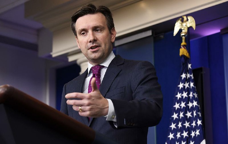 White House press secretary Josh Earnest conducts the daily briefing Tuesday at the White House in Washington.