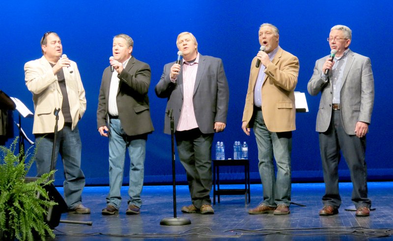 Photo by Susan Holland Piano player Jon Pickup, left, joined members of the Sonshine Quartet to sing a number at their Reunion 2015 concert this spring at the Gravette High School Performing Arts Center. The quartet, Don (Bubba) Donell, Bruce Wilbanks, Lee Donell and Steve Tucker, will perform at 1:30 p.m. Saturday on the main stage in Kindley Park.