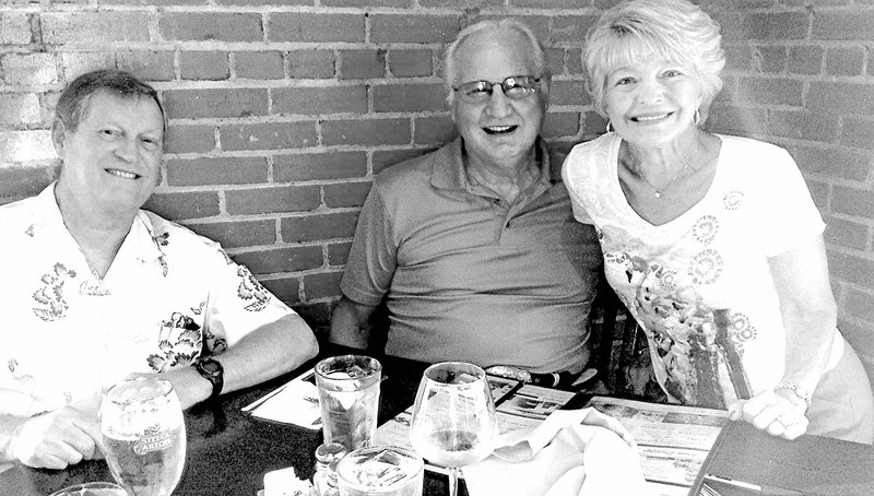 Mike Allum (left), Jimm Larry Hendren and Janet Hendren enjoyed a dinner together recently near Mike’s home in Texas.