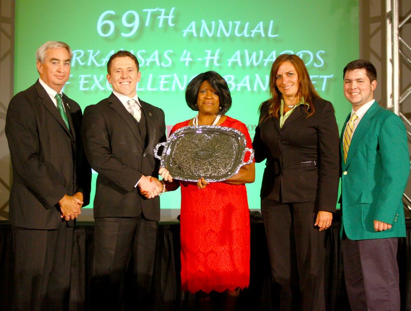 Pictured at the award presentation were: Dr. Tony Windham, associate vice president for the agriculture extension; Joshua Lockhart, 2015 Arkansas Governor’s Award recipient; Anne Sorter, associate director of family and consumer sciences and 4-H Young Development; Mrs. Nate Bell, 2015 Arkansas 4-H Governor’s Award judges board representative and wife of Rep. Nate Bell; and Boyce Cate of Green County.