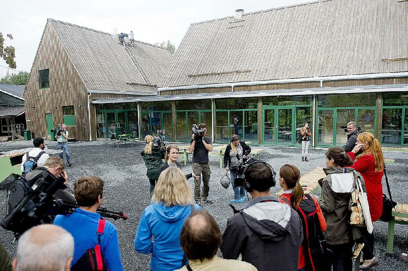 Ragnhild Kaski (center), secretary-general of the Labor Youth Party and a survivor of an extremist’s 2011 attack on a youth camp on the island of Utoya, speaks Wednesday at the reopening of the camp. story.lead_photo.caption