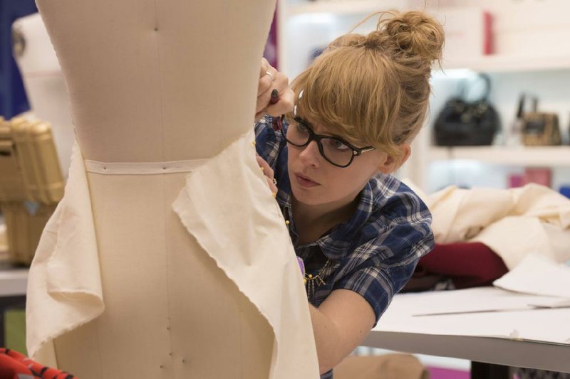 Designer Lindsey Creel concentrates on her challenge on Project Runway. Season 14 begins at 8 p.m. today on Lifetime.
