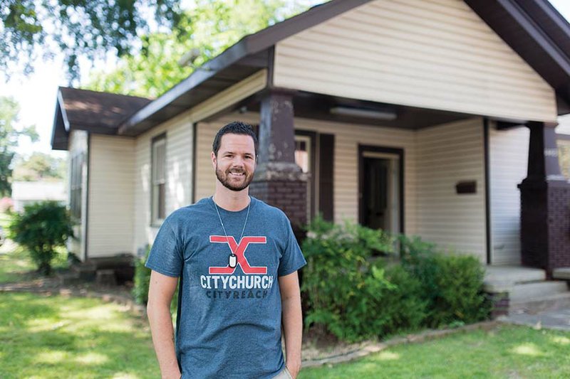 Daniel Tyler stands in front of the house at 1403 Robinson Ave. in Conway that Deliver Hope is leasing from Faulkner County to be used as a central office and resource center. Tyler founded the nonprofit Christian organization in 2013 to mentor juvenile offenders, and the house is across the street from the Faulkner County Detention Center.