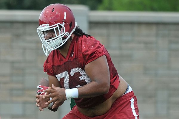 Arkansas guard Sebastian Tretola practices Thursday, Aug. 6, 2015, in Fayetteville. 