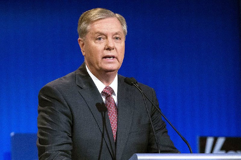 Republican presidential candidate Lindsey Graham speaks during a pre-debate forum at the Quicken Loans Arena, Thursday, Aug. 6, 2015, in Cleveland.