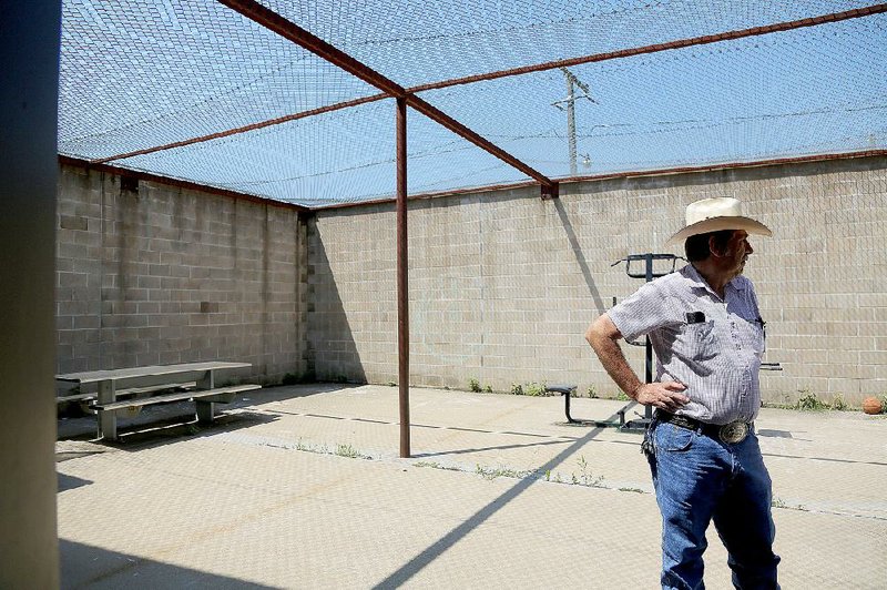 Yell County Juvenile Detention Center Administrator Mike May stands in the recreation yard of the lockup in Danville. “Everybody has been pretty receptive to everything we’ve done,” he said. “They’ve seen the difference in the kids.”
