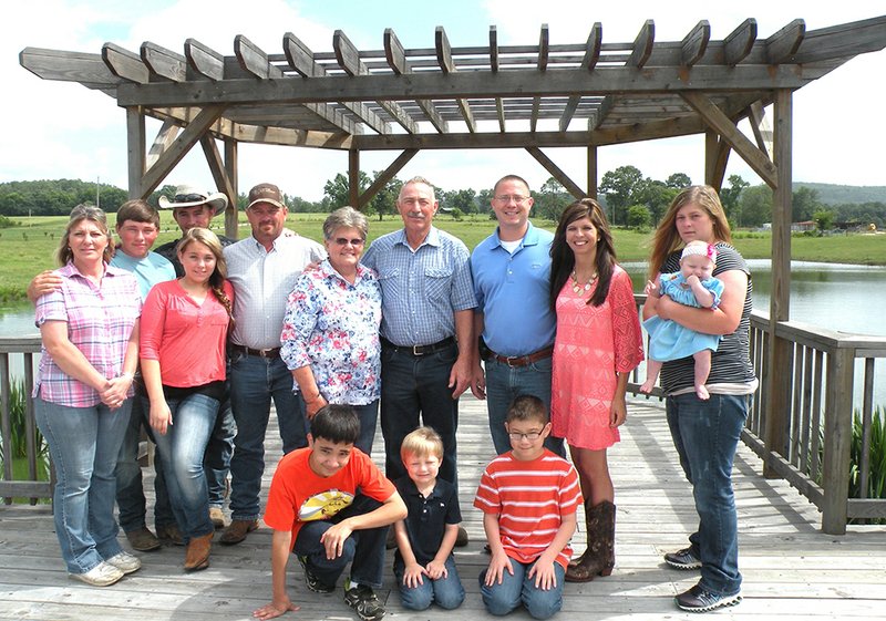 Members of the Gary Ausley family include, front row, from left, Noah Breitenfeld, Brayden Allman and Eli Breitenfeld; and standing, from left, Shannon Ausley, Josh Ausley, Elizabeth “Beth” Ausley, Blake Ausley (wearing a straw hat), Chad Ausley (wearing a ball cap), Donna Ausley, Gary Ausley, Brett Ausley, Pasha Ausley and Amy Allman, holding her 6-month-old daughter, Harper.