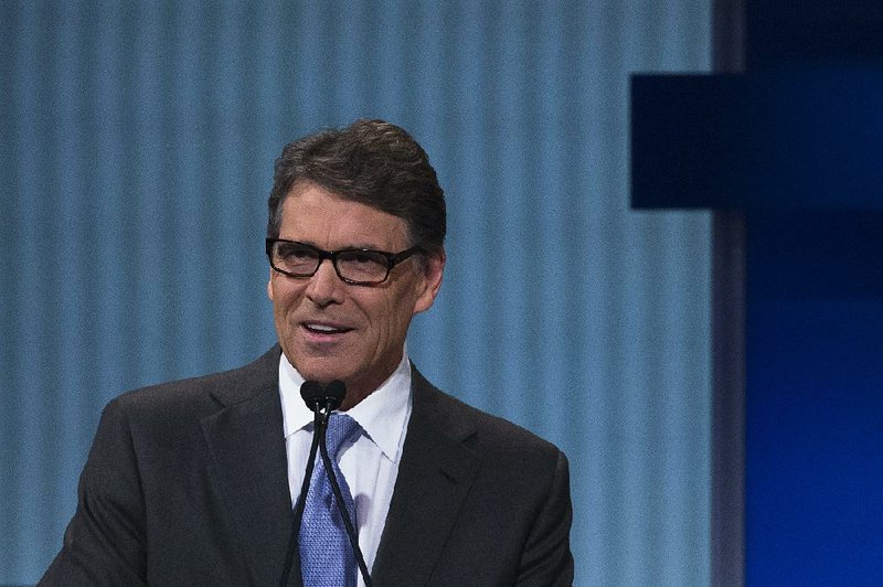 Former Texas Gov. Rick Perry participates a pre-debate forum at the Quicken Loans Arena, Thursday, Aug. 6, 2015, in Cleveland. 