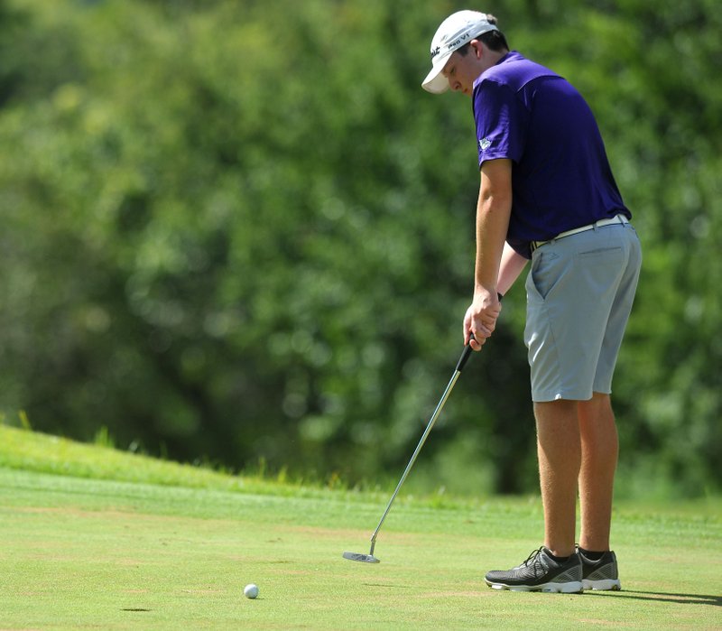 NWA Democrat-Gazette/MICHAEL WOODS &#8226; @NWAMICHAELW Jake Warner of Fayetteville attempts a putt during the golf match Tuesday against Shiloh Christian at the Links in Fayetteville.