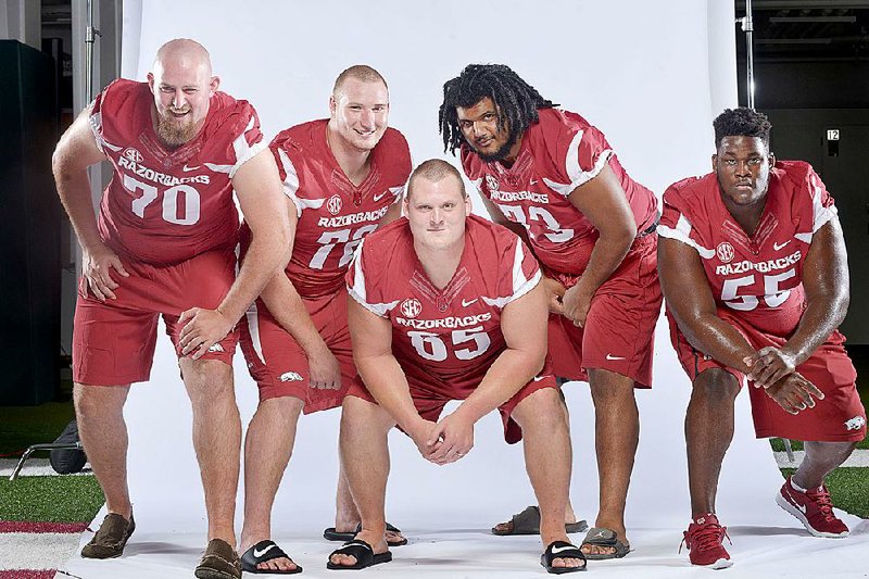 NWA Democrat-Gazette/BEN GOFF ‚Ä¢ @NWABENGOFF
The Arkansas inside offensive line (from left) Dan Skipper,  Frank Ragnow, Mitch Smothers, Sebastian Tretola and Denver Kirkland pose for a photo on Sunday Aug. 9, 2015 during Arkansas football media day at the Fred W. Smith Football Center in Fayetteville. 