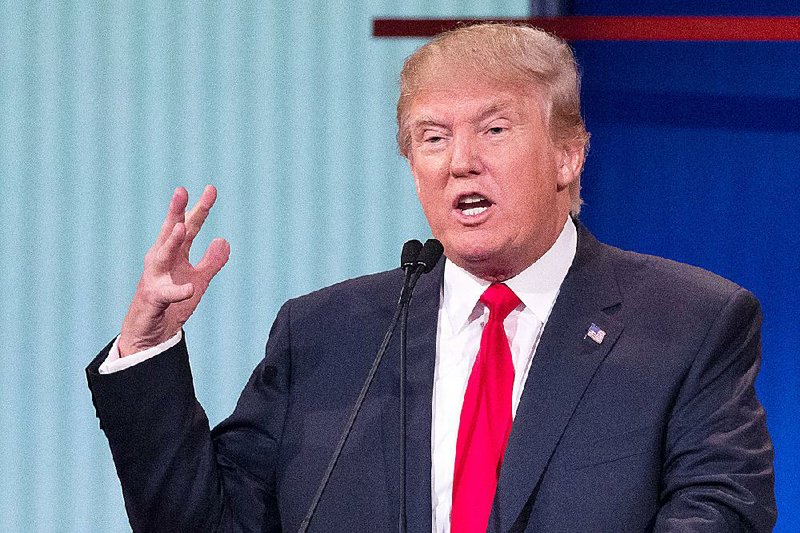 Republican presidential candidate Donald Trump participates in the first Republican presidential debate at the Quicken Loans Arena Thursday, Aug. 6, 2015, in Cleveland. 