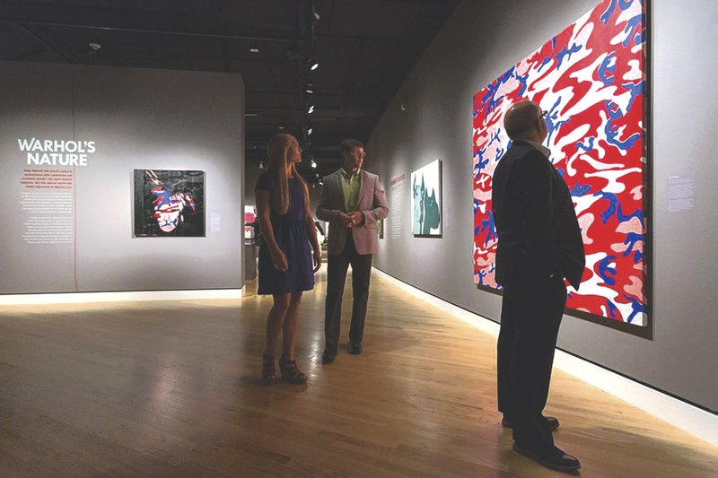Guests peruse the exhibit “Warhol’s Nature,” which is on display through early October at Crystal Bridges Museum of American Art. “The 13 Most Beautiful Songs…” is a multimedia event to help audiences interact with the exhibit.
