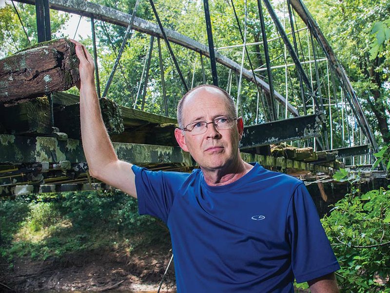 Kenneth Barnes, a member of the Faulkner County Historical Society, heads up the effort to save the Springfield-Des Arc Bridge, which was built in 1874 on the north branch of Cadron Creek, which separates Faulkner and Conway counties. story.lead_photo.caption